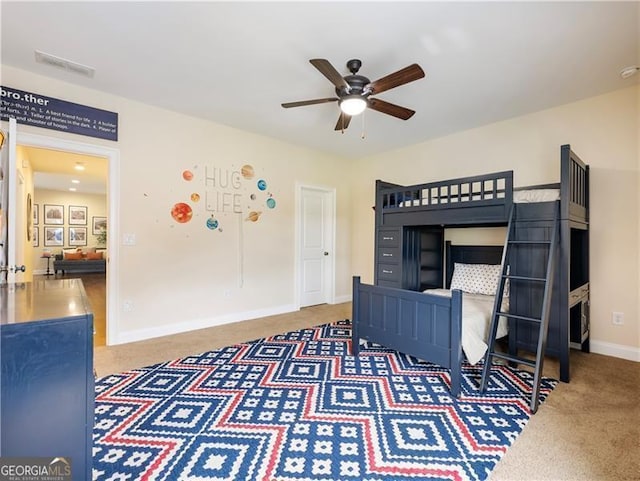 carpeted bedroom with baseboards and visible vents