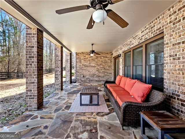 view of patio with fence and an outdoor hangout area