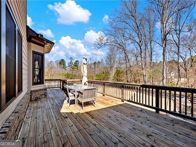 wooden deck with outdoor dining area