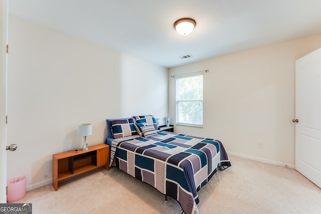 bedroom with light carpet