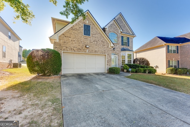 front of property with a front lawn and a garage