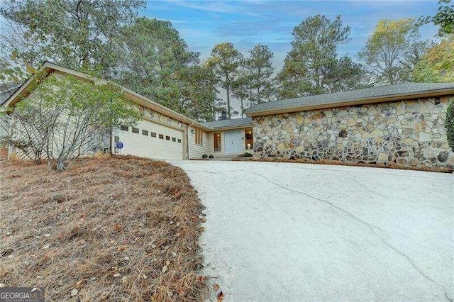 ranch-style home featuring a garage