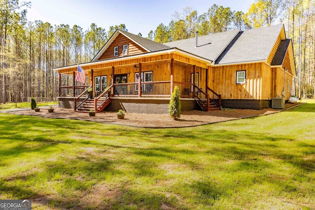 back of house featuring a lawn, cooling unit, and a porch