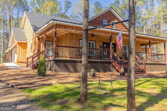 rear view of property with a porch