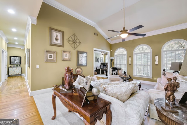 living room featuring light wood-type flooring, vaulted ceiling, and crown molding