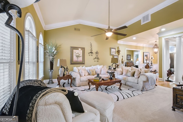 living room with ceiling fan, light hardwood / wood-style floors, vaulted ceiling, and ornamental molding