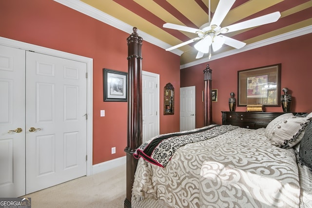 carpeted bedroom featuring a closet, ceiling fan, and crown molding