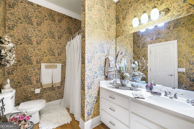 bathroom featuring toilet, hardwood / wood-style floors, ornamental molding, vanity, and a shower with shower curtain