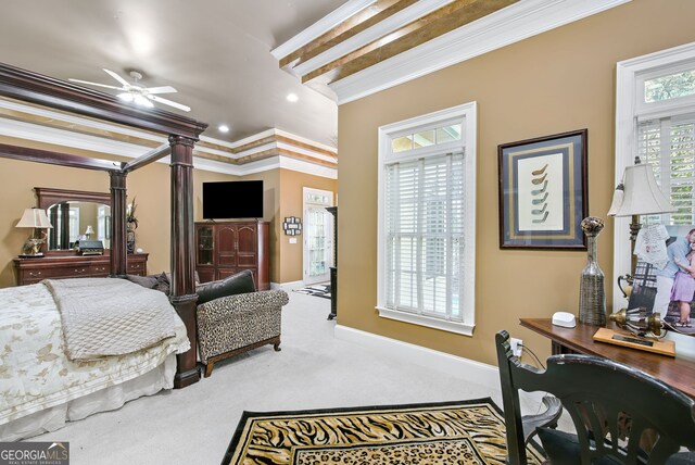 carpeted bedroom with ceiling fan and crown molding