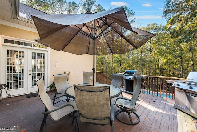 wooden terrace featuring grilling area