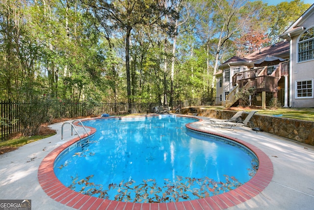 view of pool with a deck and a patio area