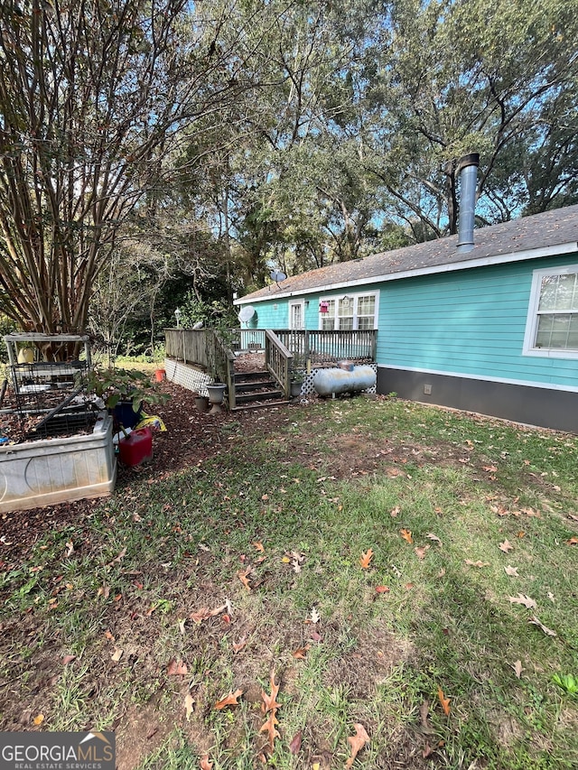 view of yard with a wooden deck