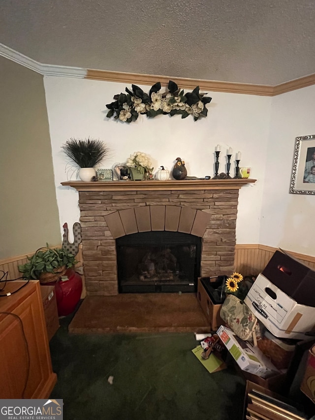 living room with a fireplace, a textured ceiling, wooden walls, and ornamental molding