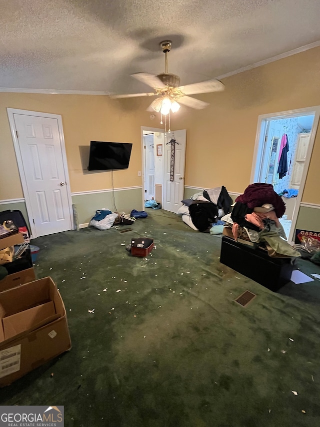 carpeted living room featuring ornamental molding, lofted ceiling, a textured ceiling, and ceiling fan