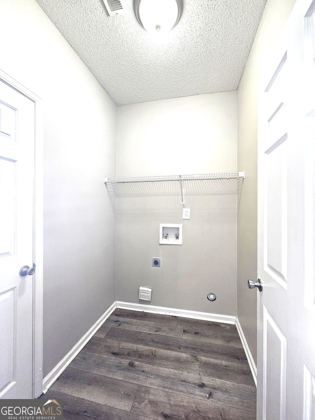 laundry room featuring washer hookup, a textured ceiling, hookup for an electric dryer, and dark hardwood / wood-style flooring