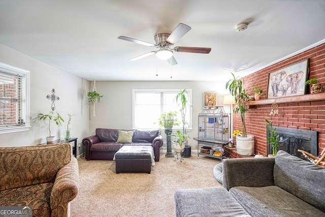 living room with a fireplace, ceiling fan, and carpet flooring