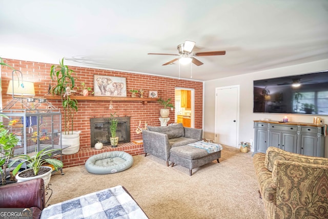 carpeted living room featuring brick wall, ceiling fan, and a brick fireplace