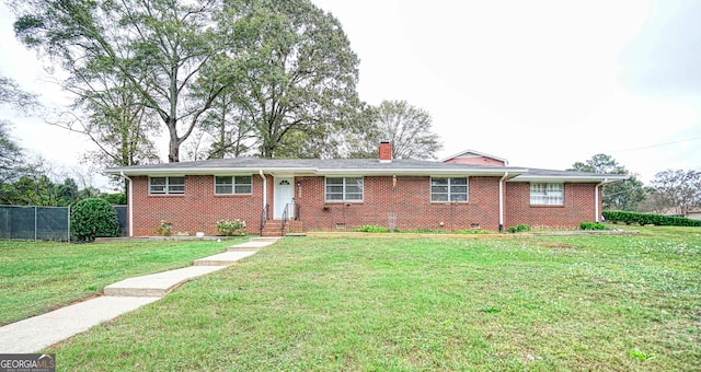 ranch-style house featuring a front yard