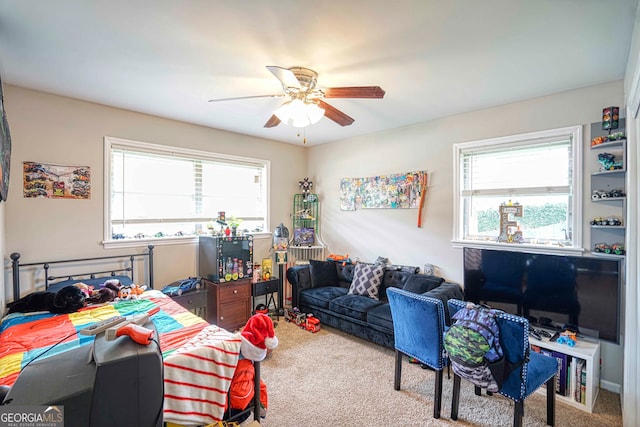 interior space with carpet floors and ceiling fan