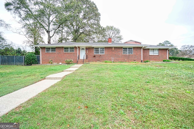 ranch-style house featuring a front yard