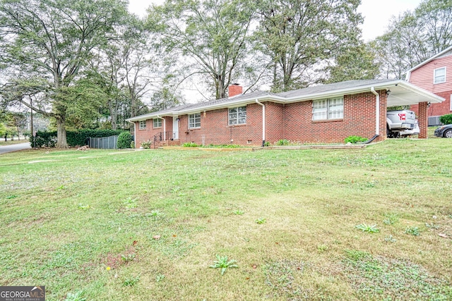 ranch-style home with a front yard and a carport