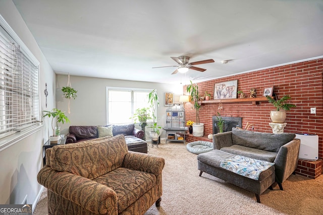 living room featuring carpet, a fireplace, brick wall, and ceiling fan