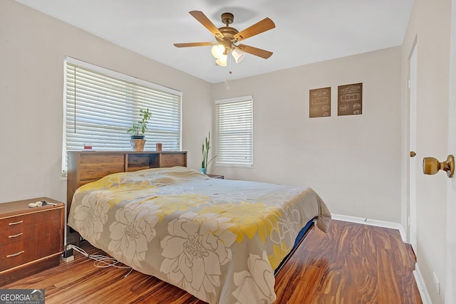 bedroom featuring hardwood / wood-style flooring and ceiling fan