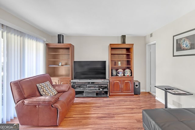 living room with light hardwood / wood-style floors