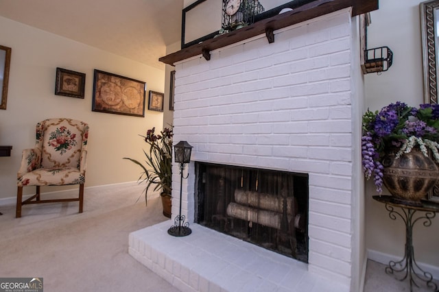 interior space with light carpet and a brick fireplace