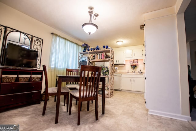 dining space with sink