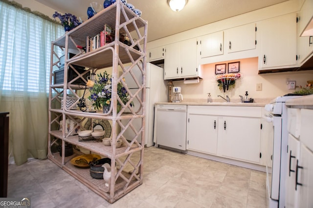 kitchen with white appliances and white cabinetry