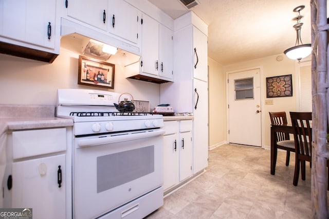 kitchen featuring white gas range, white cabinetry, pendant lighting, and a textured ceiling