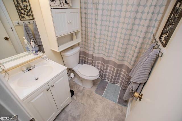 bathroom with vanity and toilet