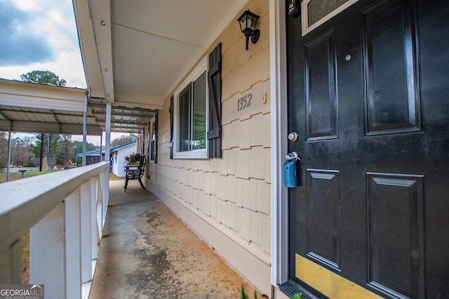 doorway to property featuring covered porch