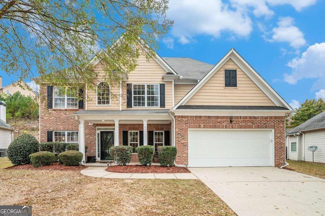 view of front of home with a garage and covered porch