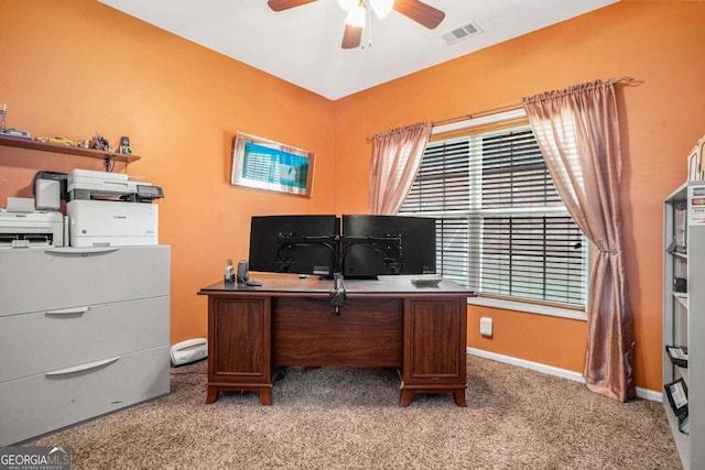 carpeted office featuring ceiling fan and plenty of natural light