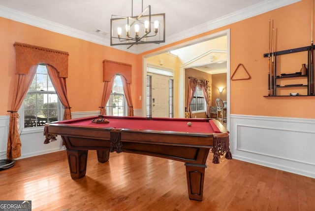 game room featuring ornamental molding and wood-type flooring