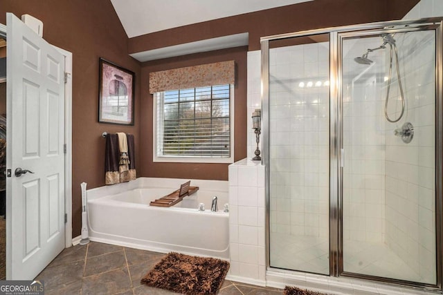 bathroom featuring vaulted ceiling, tile patterned floors, and separate shower and tub