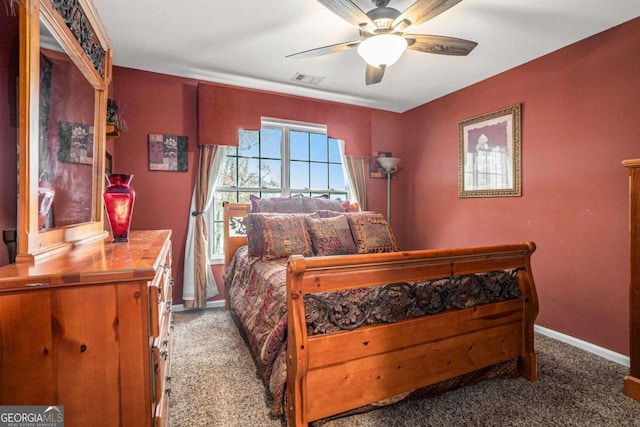 bedroom with ceiling fan and carpet floors