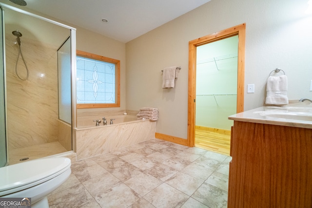 full bathroom featuring vanity, tile patterned flooring, plus walk in shower, and toilet