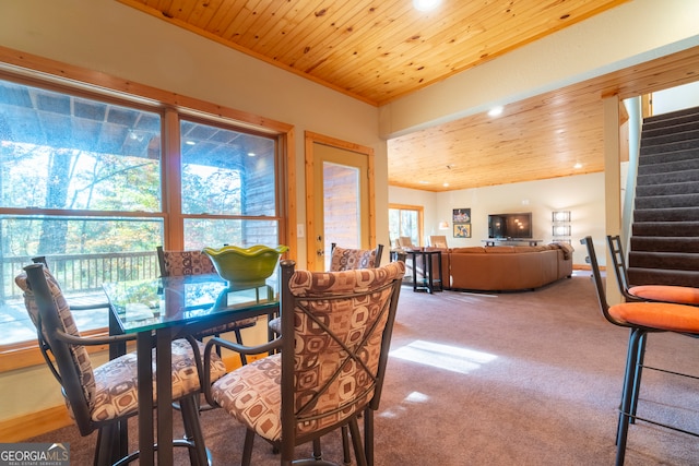 dining space with wood ceiling and carpet floors