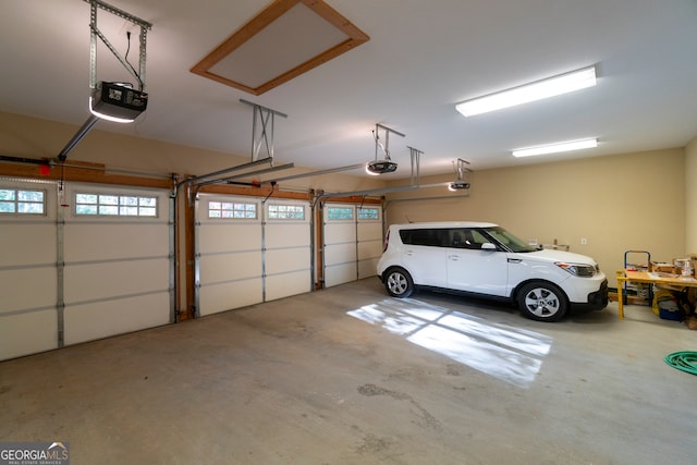 garage featuring a garage door opener