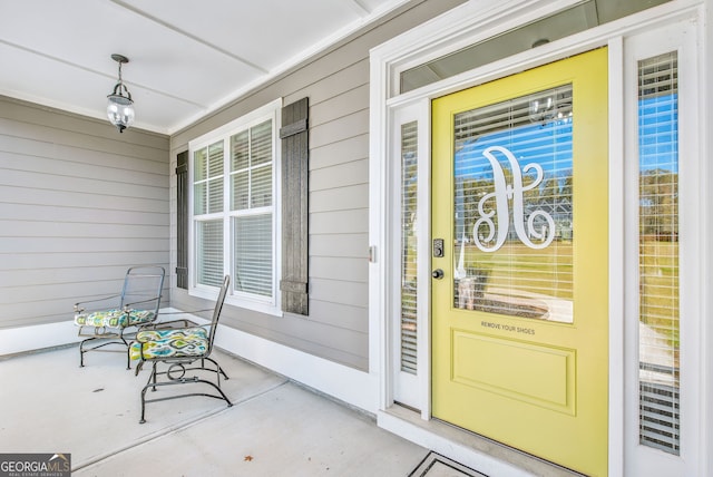 doorway to property featuring a porch