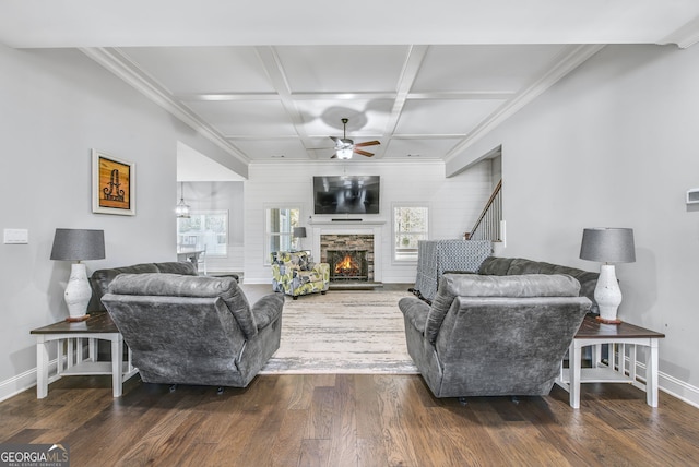 living room with coffered ceiling, dark hardwood / wood-style floors, ceiling fan, beam ceiling, and a fireplace