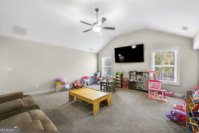 playroom with ceiling fan, lofted ceiling, and carpet floors