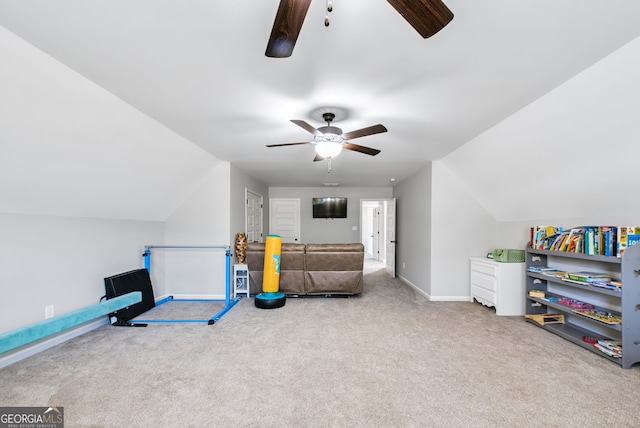 rec room with vaulted ceiling, ceiling fan, and carpet floors