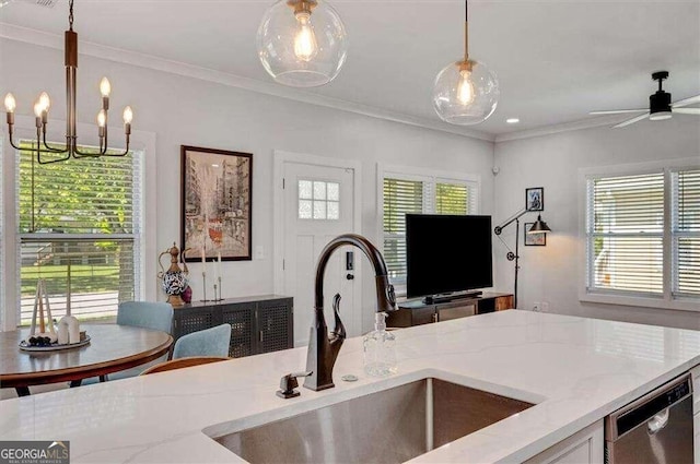 kitchen with dishwasher, a wealth of natural light, hanging light fixtures, and sink