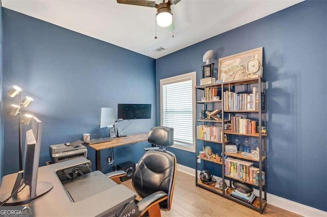 office featuring hardwood / wood-style floors and ceiling fan