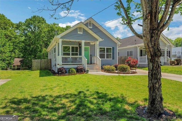 bungalow-style home featuring a porch and a front yard