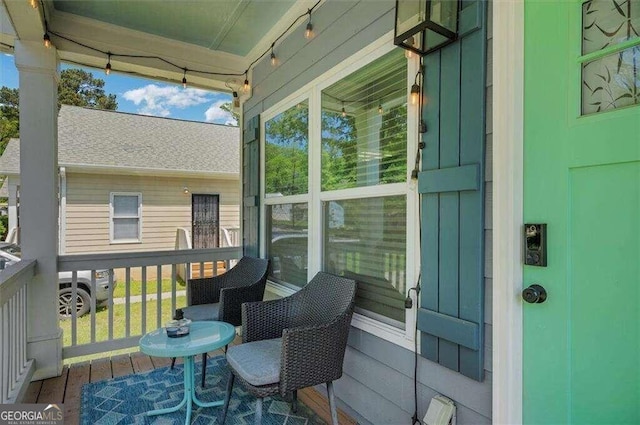 wooden terrace with a porch